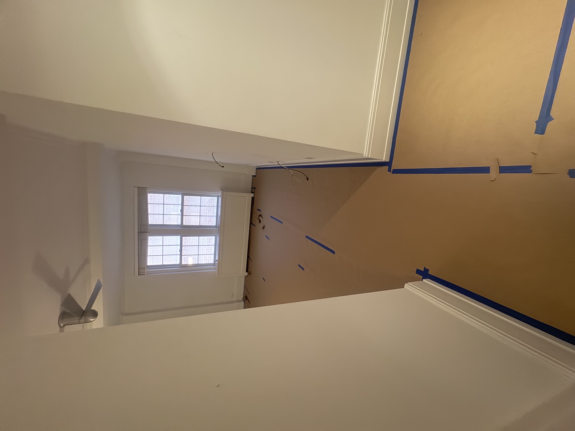 Stairwell paint prep in a Brooklyn brownstone
