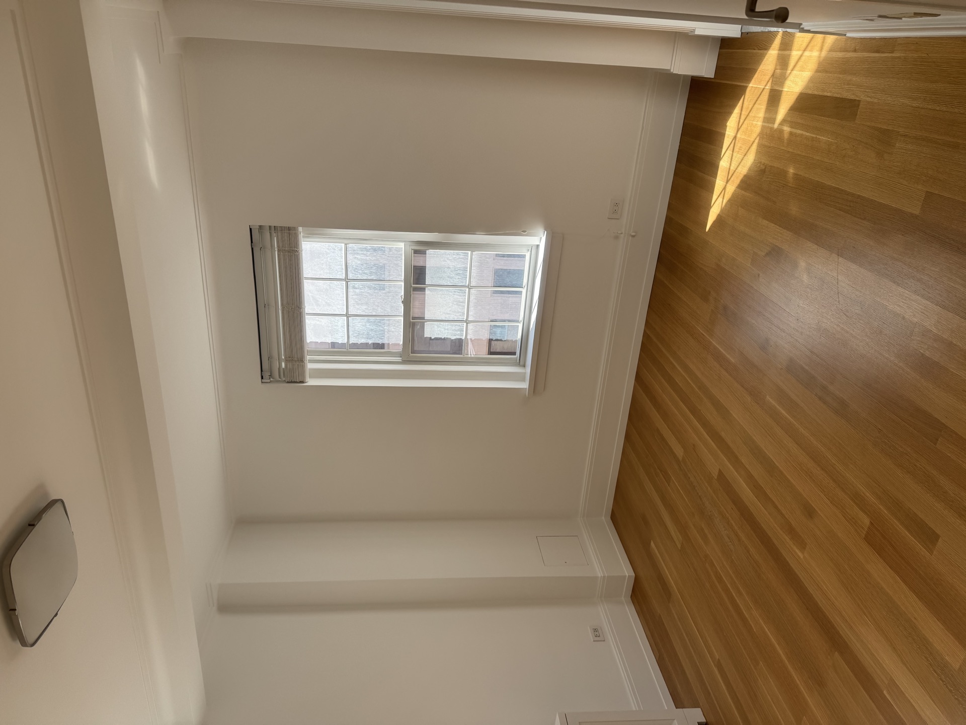 Hardwood floors and fresh white baseboards