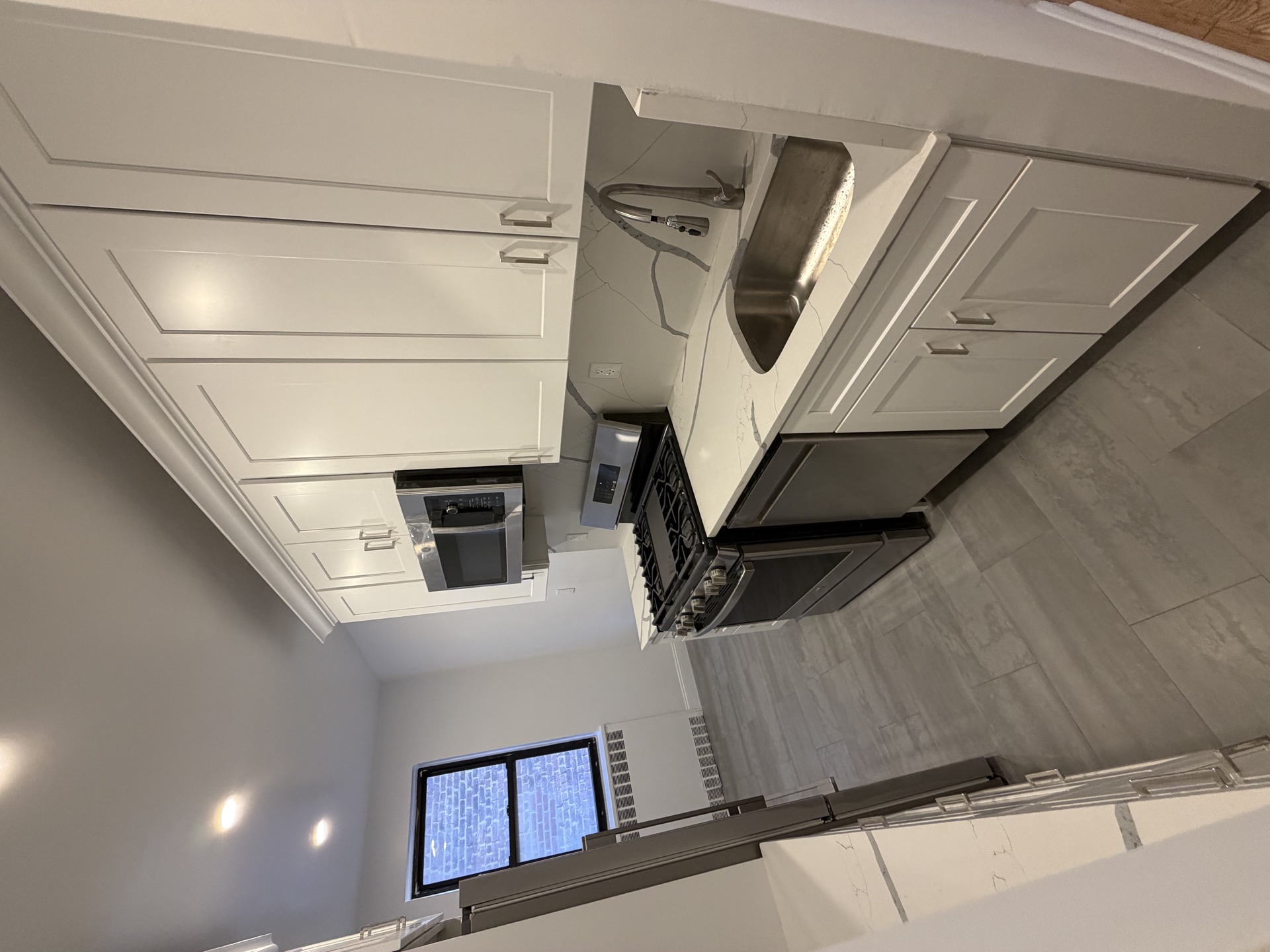 White shaker kitchen with stainless range